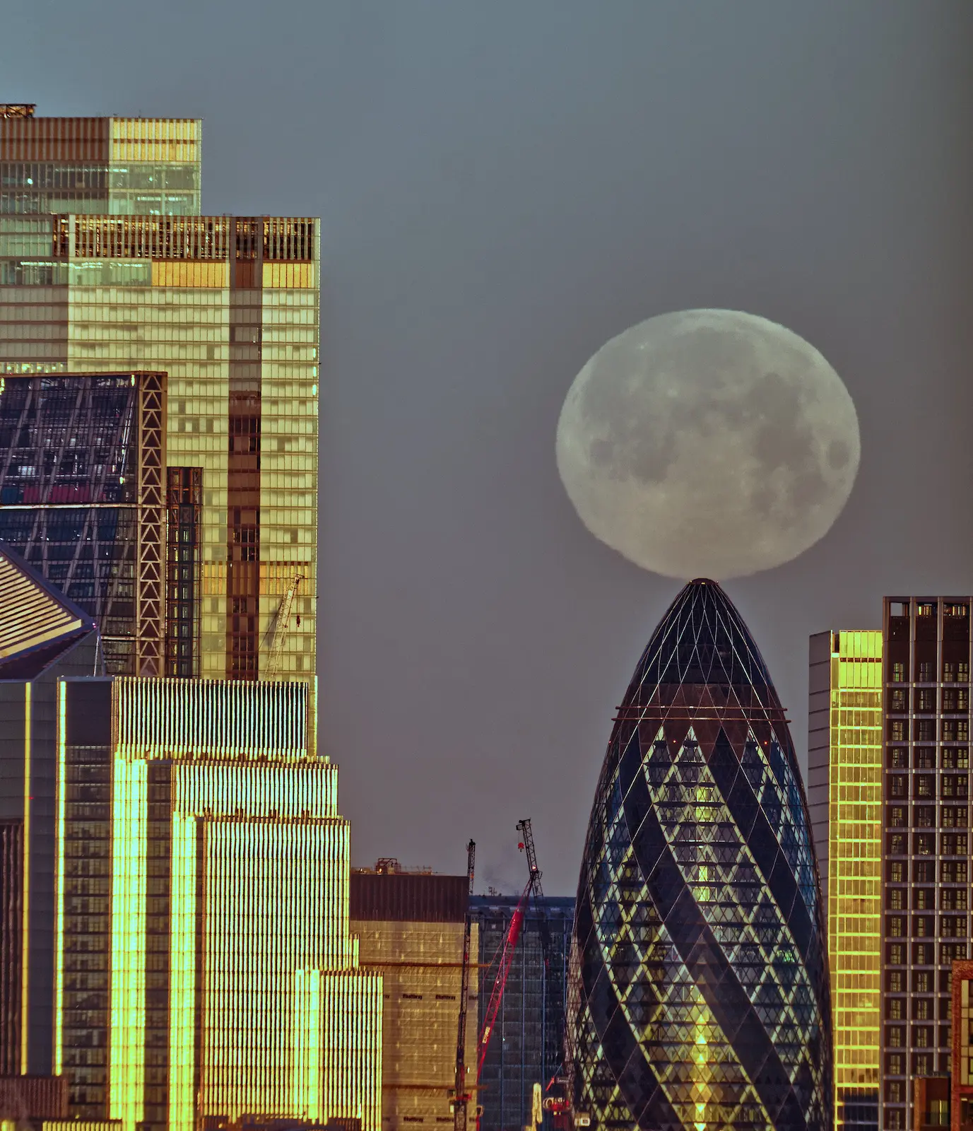 Wolf Moon balances on Gherkin London astrophotography